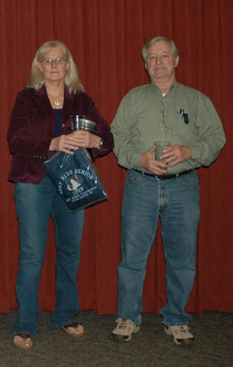 Janet Bowers and Mike Smith with awards.